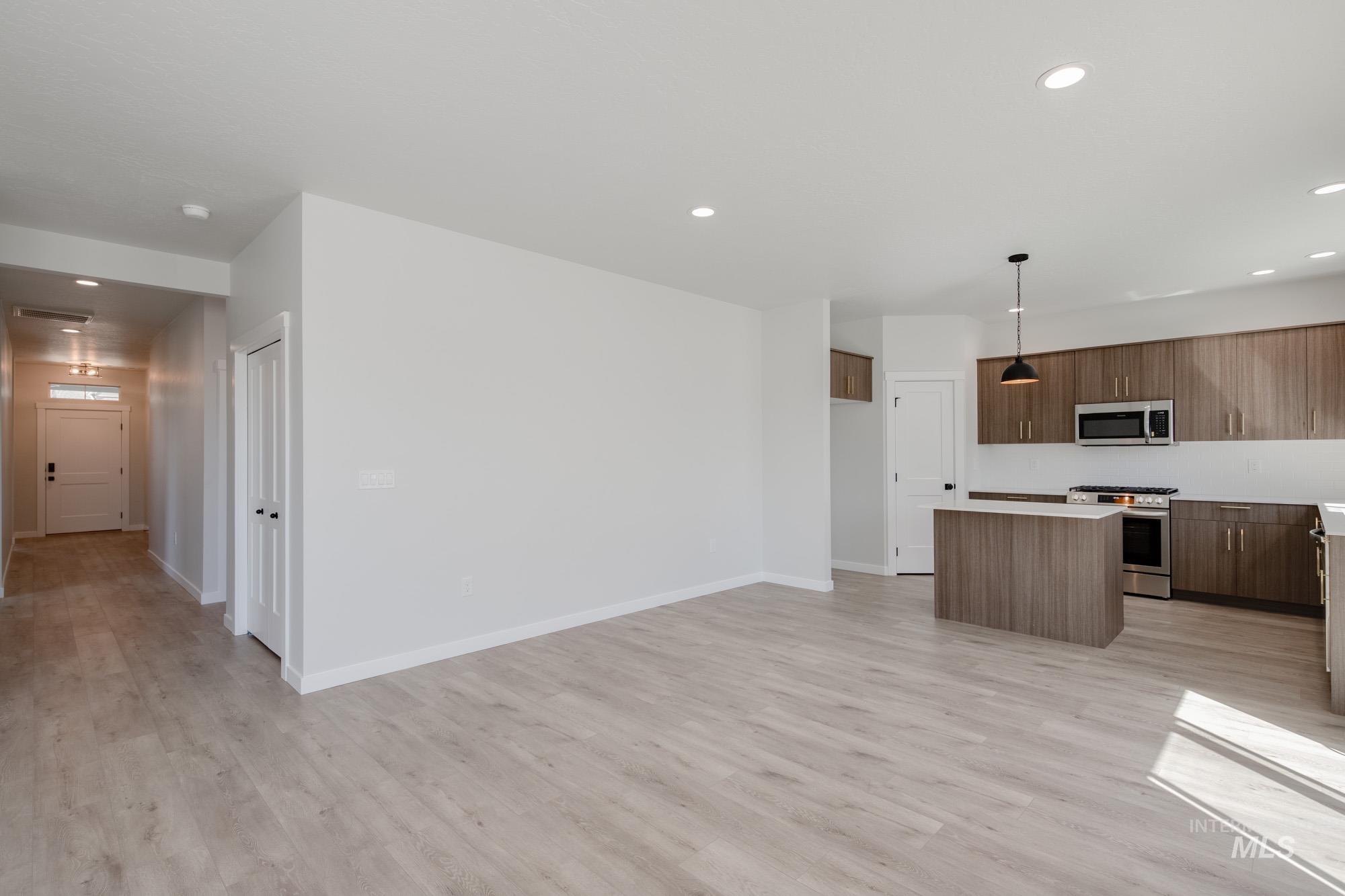 2231 South Border Way Meridian, ID 83642 - Photo 9 of 23 Kitchen featuring a kitchen island, pendant lighting, stainless steel appliances, modern cabinets, and light countertops