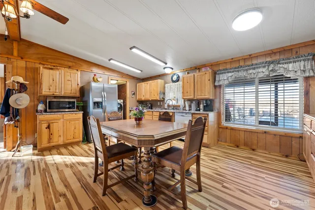 a bathroom with a sink a mirror and a shower