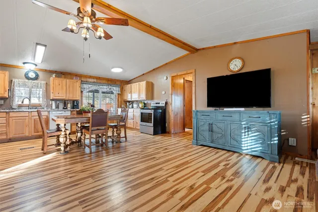 a view of a dining room with furniture window and wooden floor
