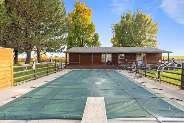 a view of a swimming pool with a lounge chairs