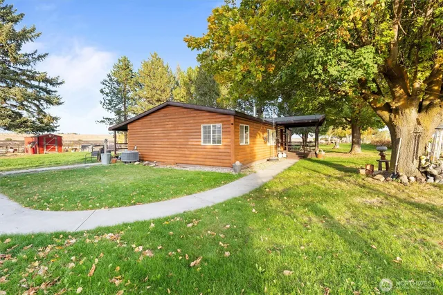 a view of a balcony with wooden floor and stairs