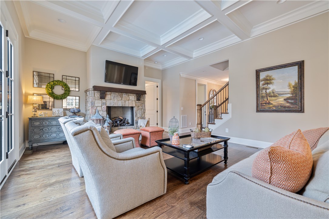 301 Stonebridge Drive Clemson, SC 29631 - Photo 7 of 47 This inviting living room showcases a beautiful fireplace and elegant coffered ceilings.