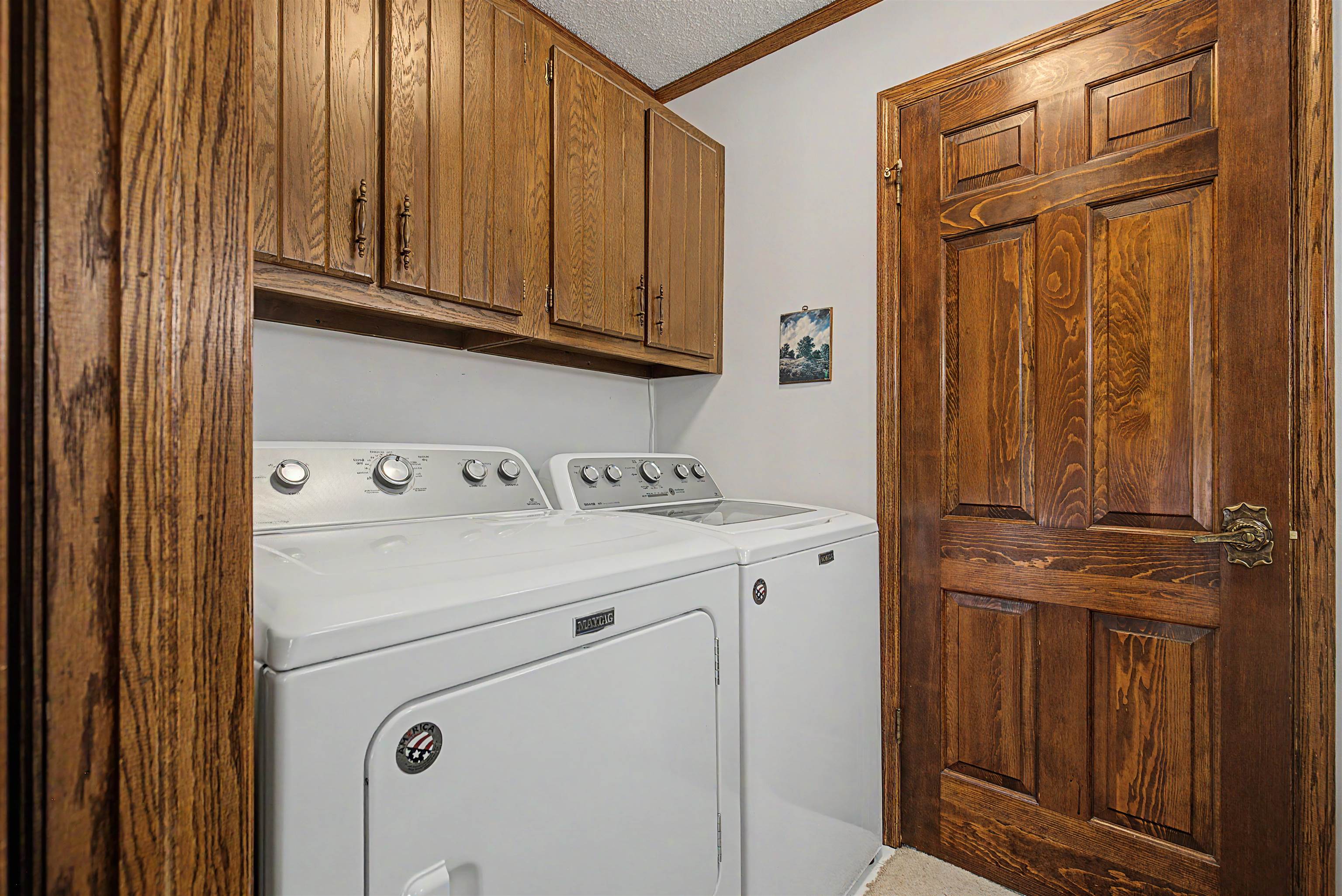 17380 Corbett Road Mount Carroll, IL 61053 - Photo 35 of 65 a utility room with dryer and washer