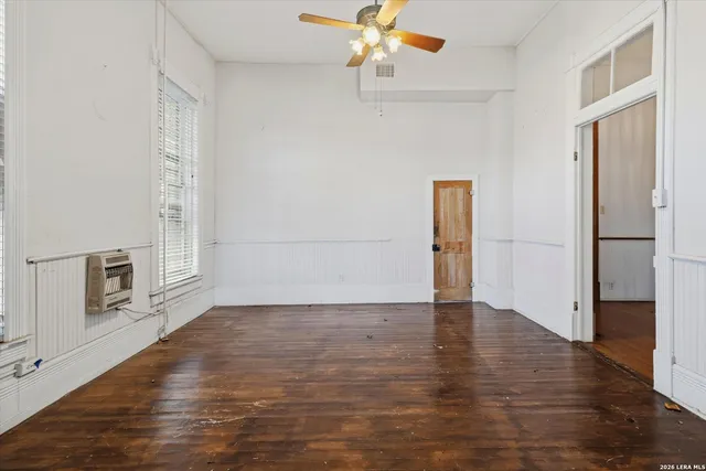 a view of an entryway with wooden floors
