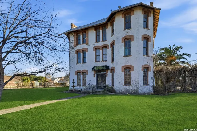 a view of an entryway with wooden floor and livingroom