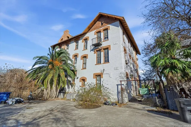 a view of a building with a yard
