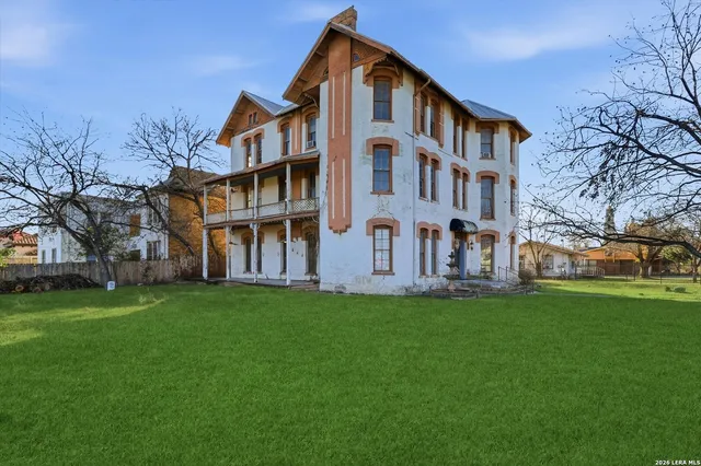 front view of a house with a tree