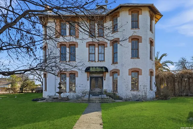 a view of residential building with large trees