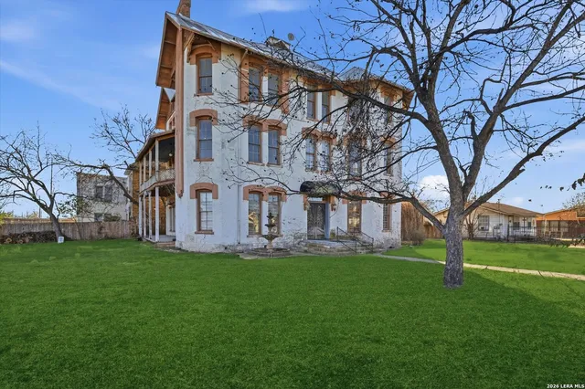 an aerial view of a house with a garden