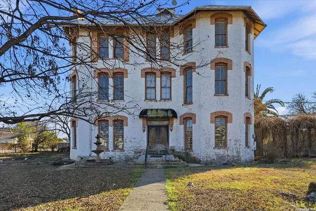 an aerial view of a house with a garden