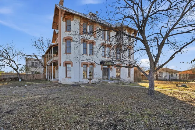 an aerial view of a house with a garden