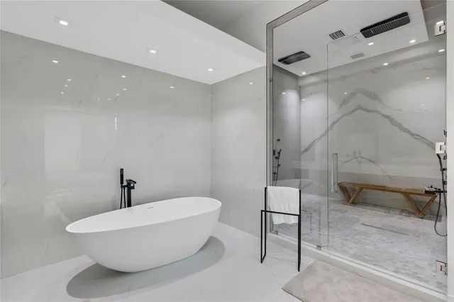 a bathroom with a toilet sink and a mirror