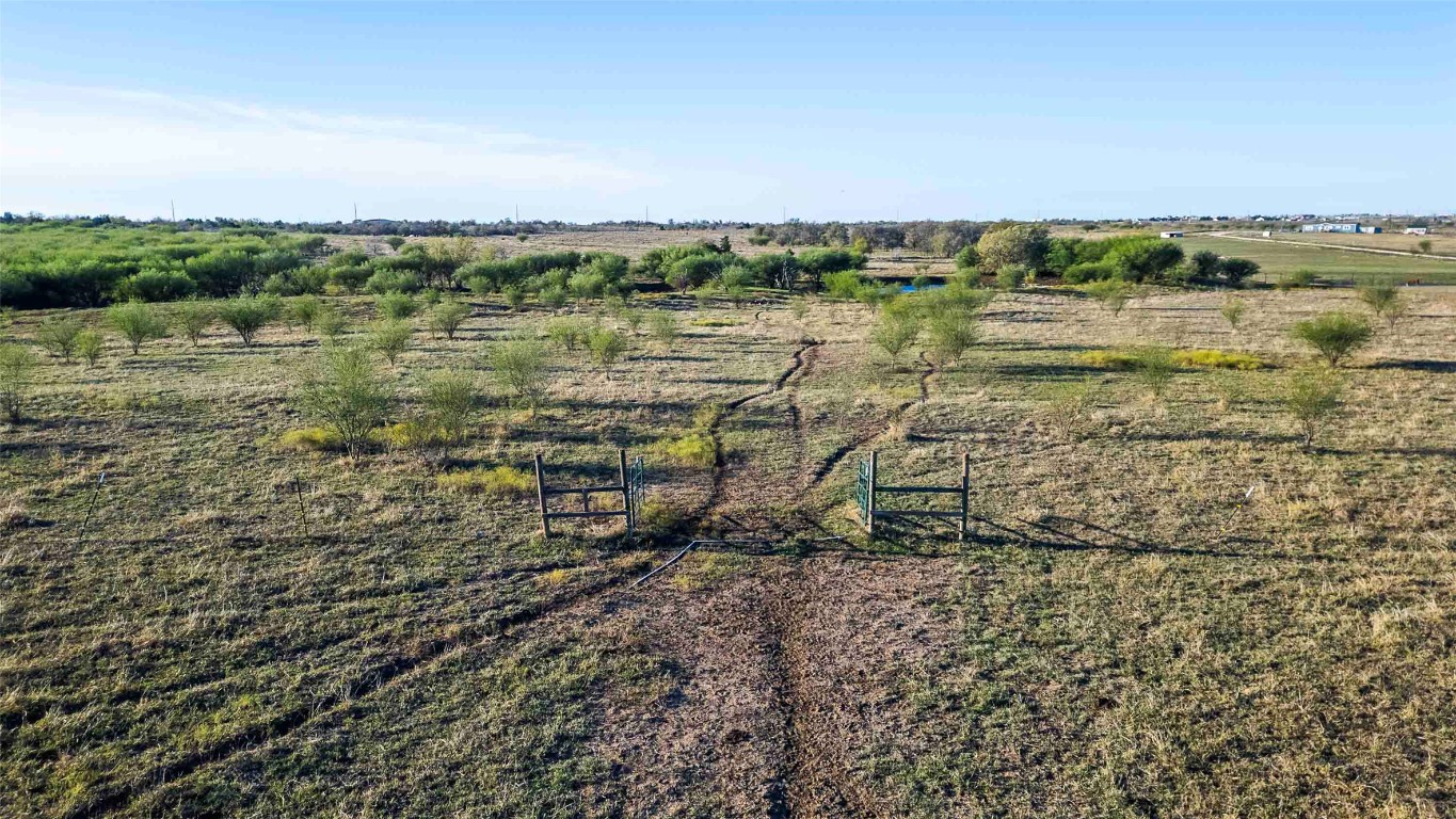 3191 County Road 463 Elgin, TX 78621 - Photo 22 of 33 a view of a lake with houses in the back