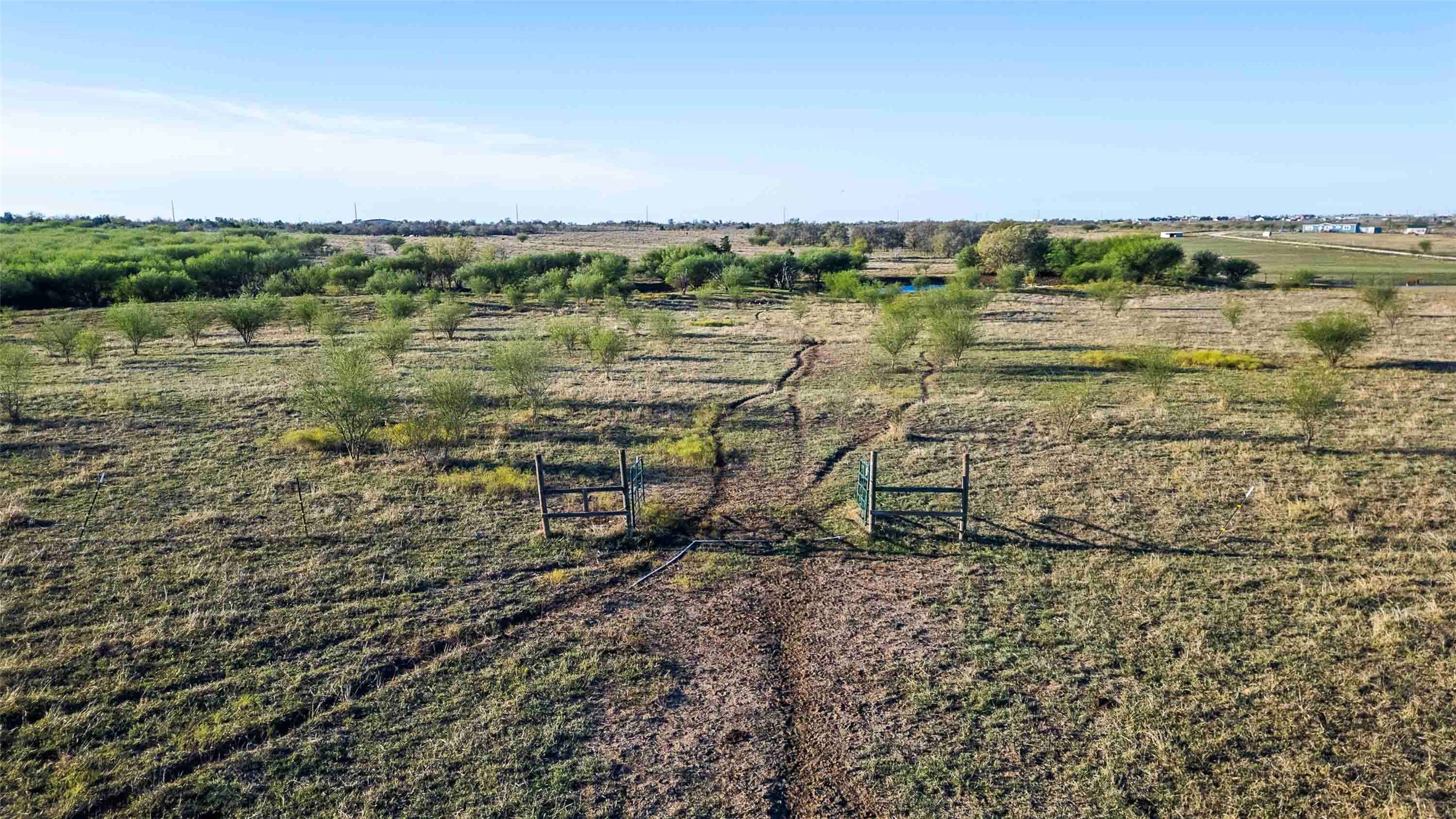 3191 County Road 463 Elgin, TX 78621 - Photo 23 of 34 a view of a lake with houses in the back