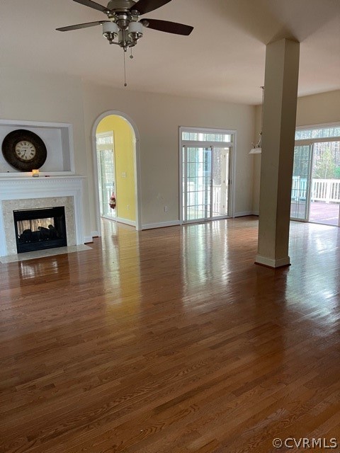16647 Brattice Mill Road Chesterfield, VA 23838 - Photo 11 of 17 an empty room with wooden floor fireplace and windows