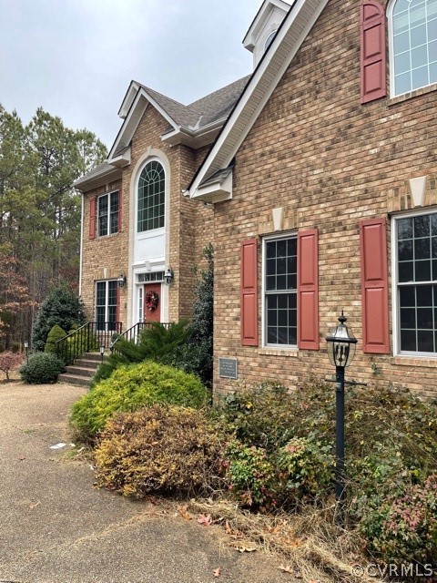 16647 Brattice Mill Road Chesterfield, VA 23838 - Photo 4 of 17 a front view of a house with garden