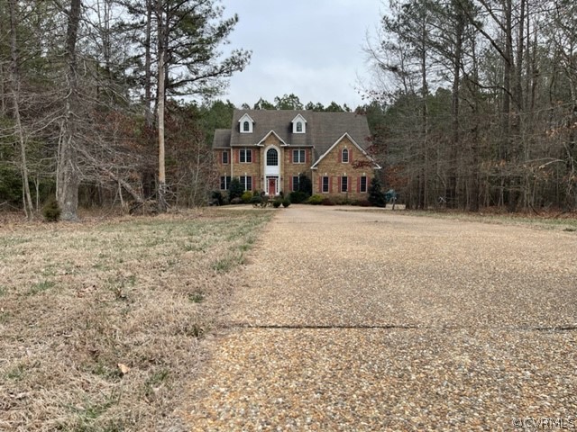 16647 Brattice Mill Road Chesterfield, VA 23838 - Photo 5 of 17 a front view of a house with a yard