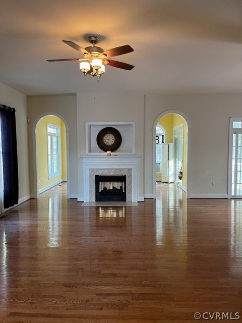 16647 Brattice Mill Road Chesterfield, VA 23838 - Photo 10 of 17 a view of a livingroom with a fireplace a ceiling fan and windows