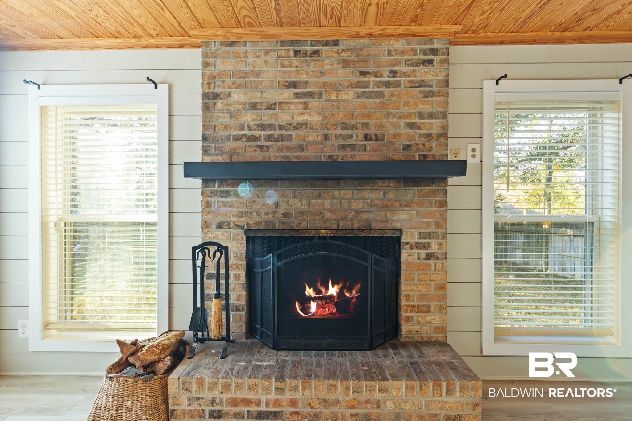 608 Southern Way Daphne, AL 36527 - Photo 16 of 35 Detailed view of wood ceiling, wood finished floors, a fireplace, crown molding, and wood walls