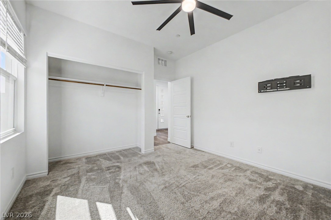 226 Augusta Ridge Henderson, NV 89015 - Photo 17 of 47 Bright and airy room with plush carpeting offers comfort and versatility.
