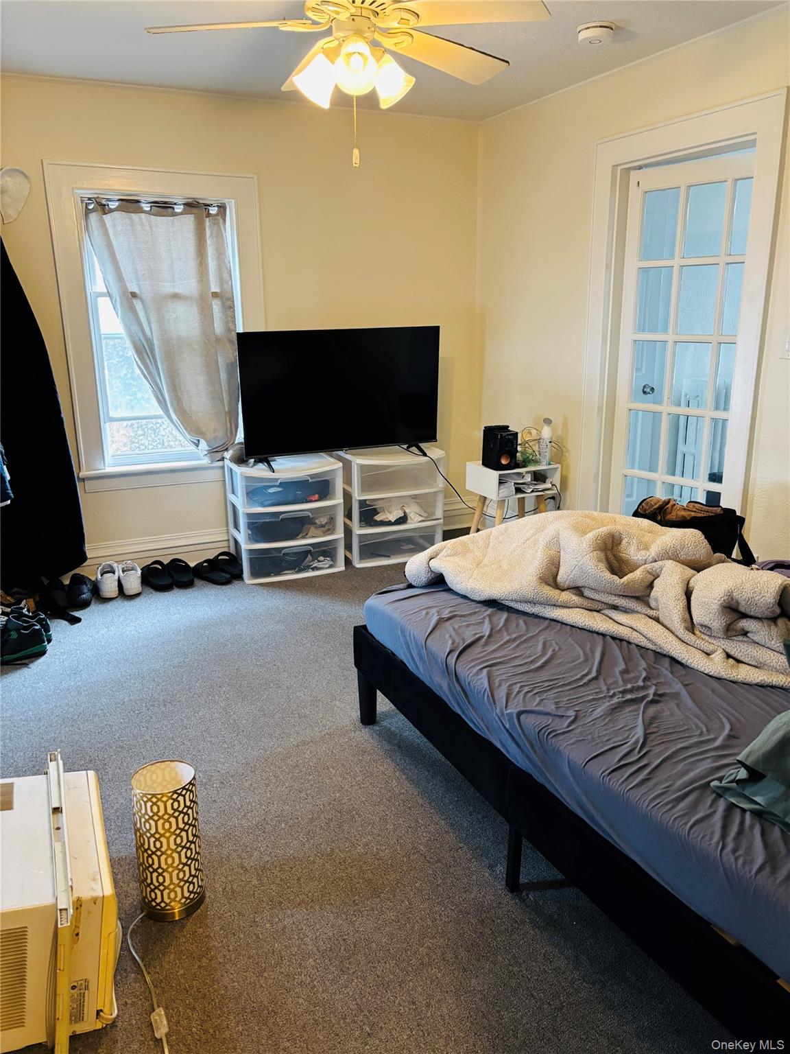 1206 Main Street Peekskill, NY 10566 - Photo 13 of 59 a bedroom with a bed and flat screen tv