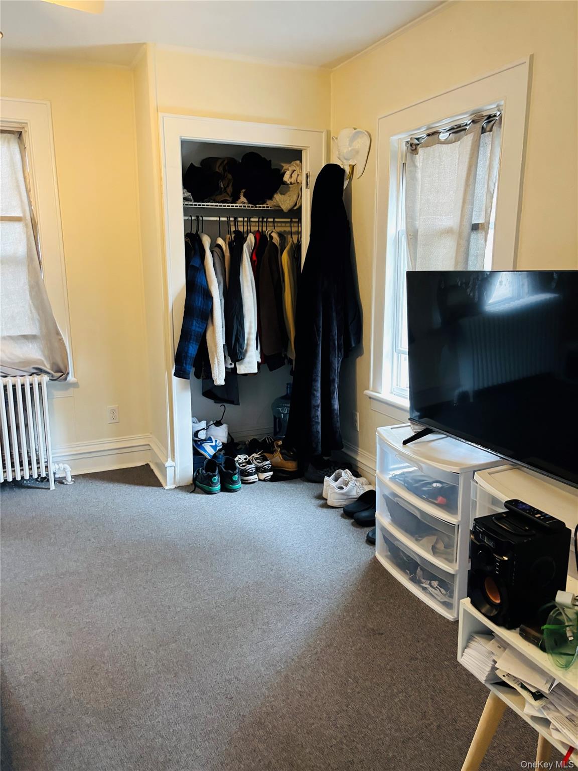 1206 Main Street Peekskill, NY 10566 - Photo 19 of 59 a view of walk in closet with clothes and shoes
