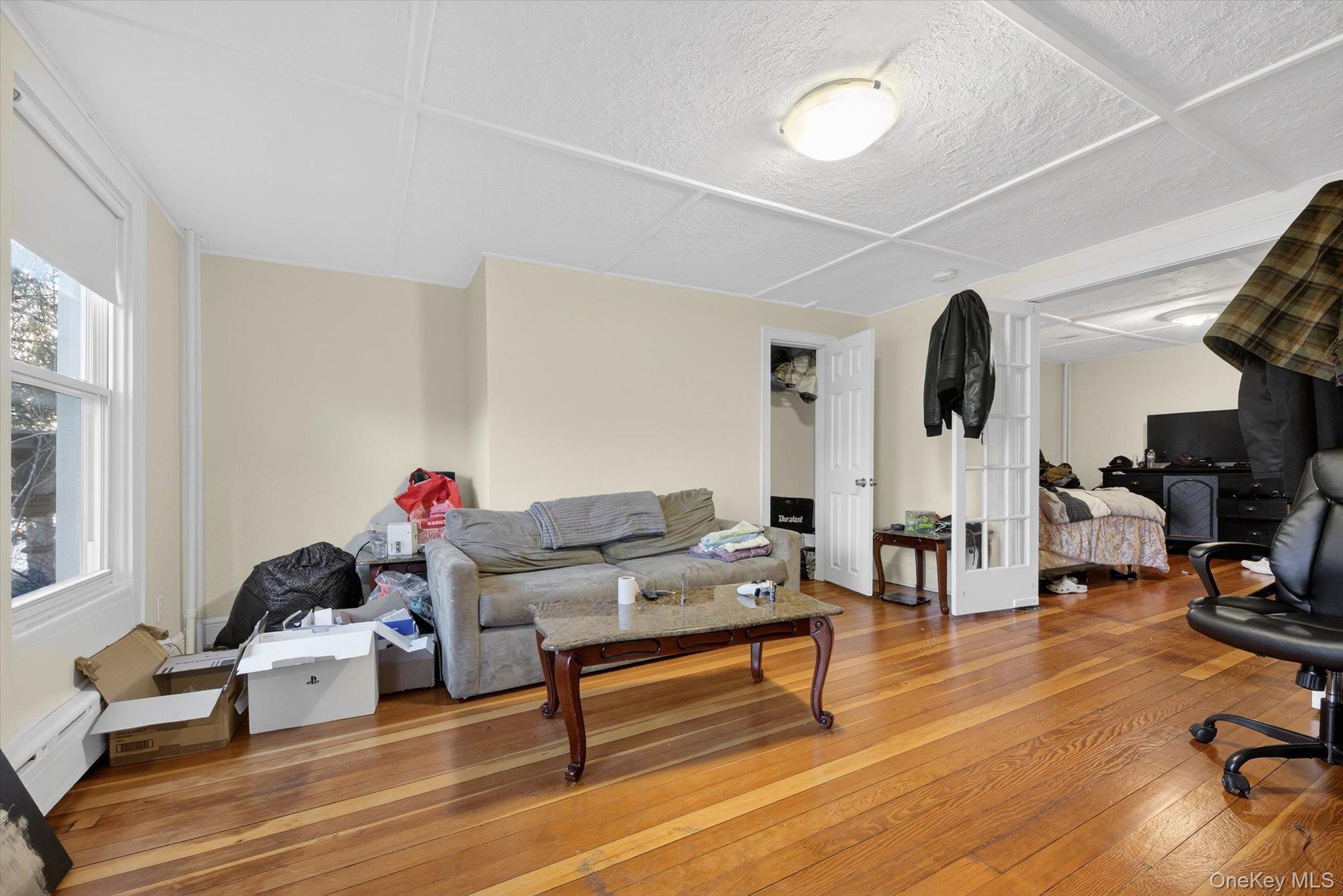 1206 Main Street Peekskill, NY 10566 - Photo 22 of 59 a living room with furniture and a wooden floor