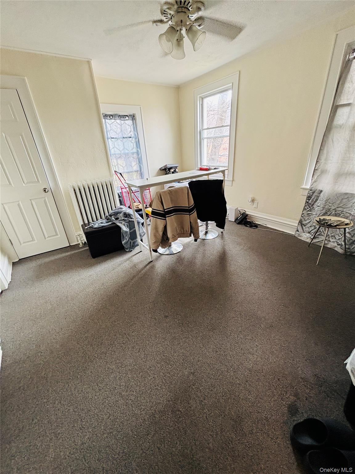 1206 Main Street Peekskill, NY 10566 - Photo 23 of 59 a living room with furniture and a window