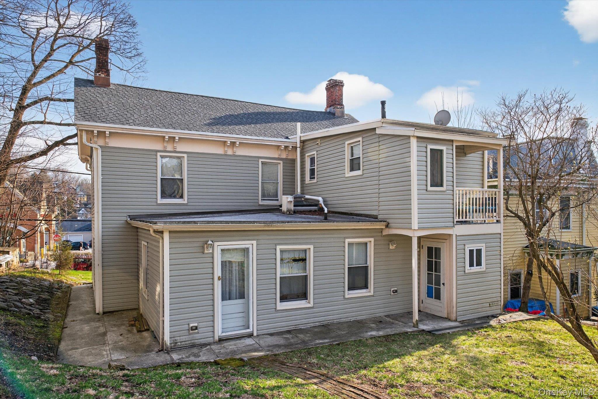 1206 Main Street Peekskill, NY 10566 - Photo 3 of 59 a front view of a house with a yard