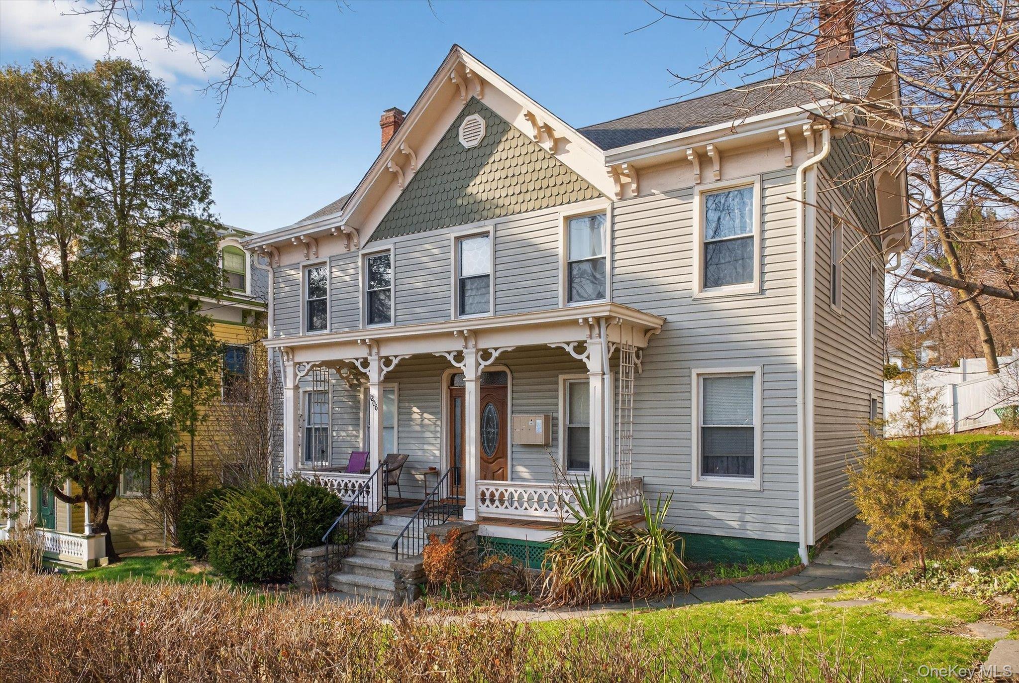 1206 Main Street Peekskill, NY 10566 - Photo 4 of 59 front view of a house with a yard