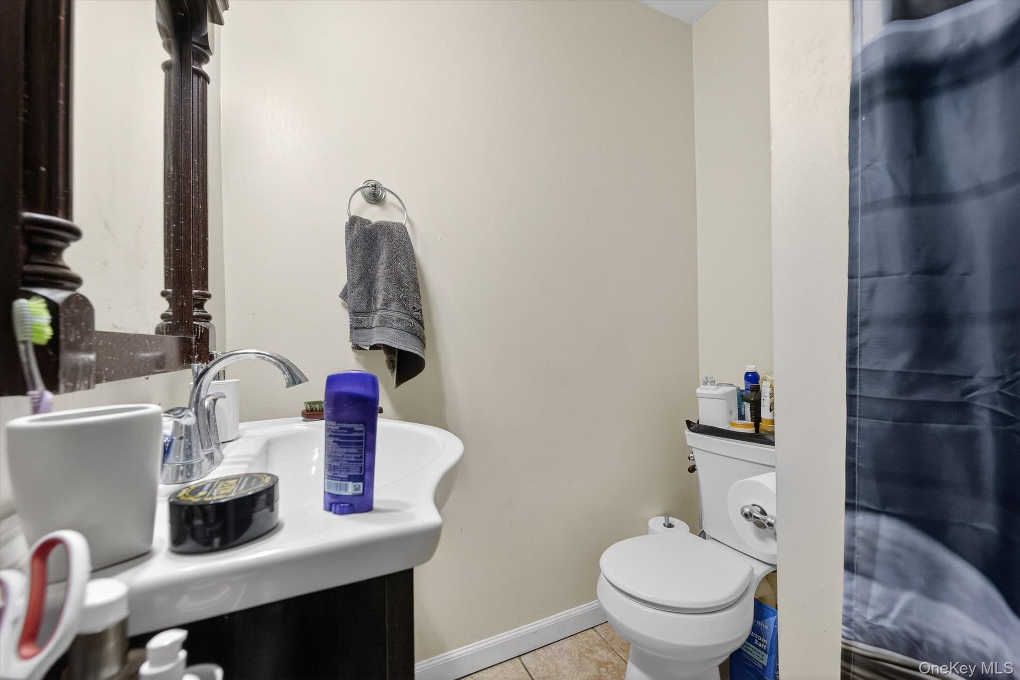 1206 Main Street Peekskill, NY 10566 - Photo 44 of 59 a bathroom with a sink toilet and a mirror
