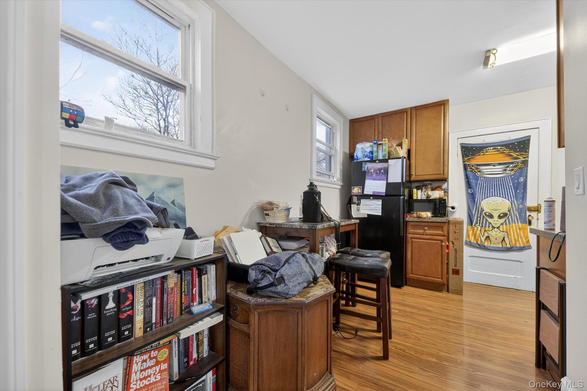1206 Main Street Peekskill, NY 10566 - Photo 46 of 59 a living room with furniture and a book shelf