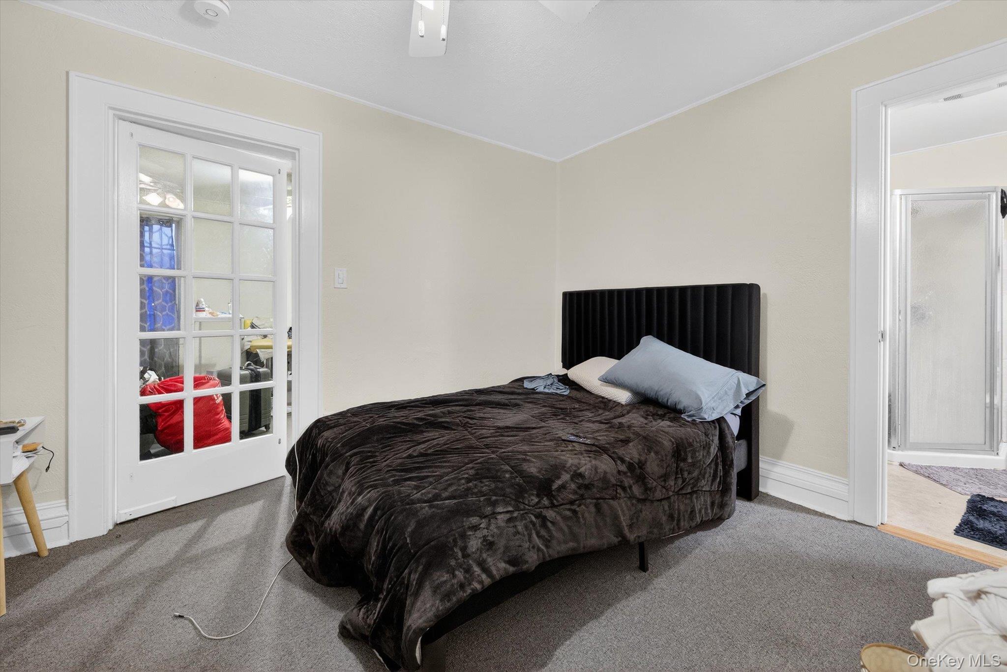 1206 Main Street Peekskill, NY 10566 - Photo 53 of 59 a bedroom with a bed and wooden floor