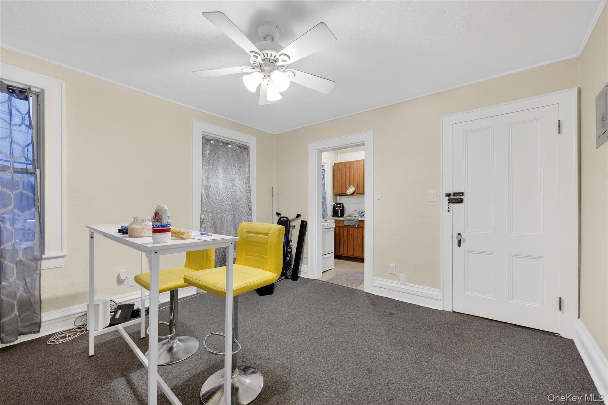 1206 Main Street Peekskill, NY 10566 - Photo 59 of 59 a living room with furniture and a chandelier