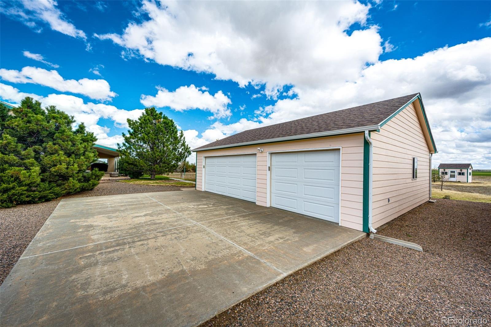 4420 Behrens Road Byers, CO 80103 - Photo 26 of 39 a view of a house with a yard