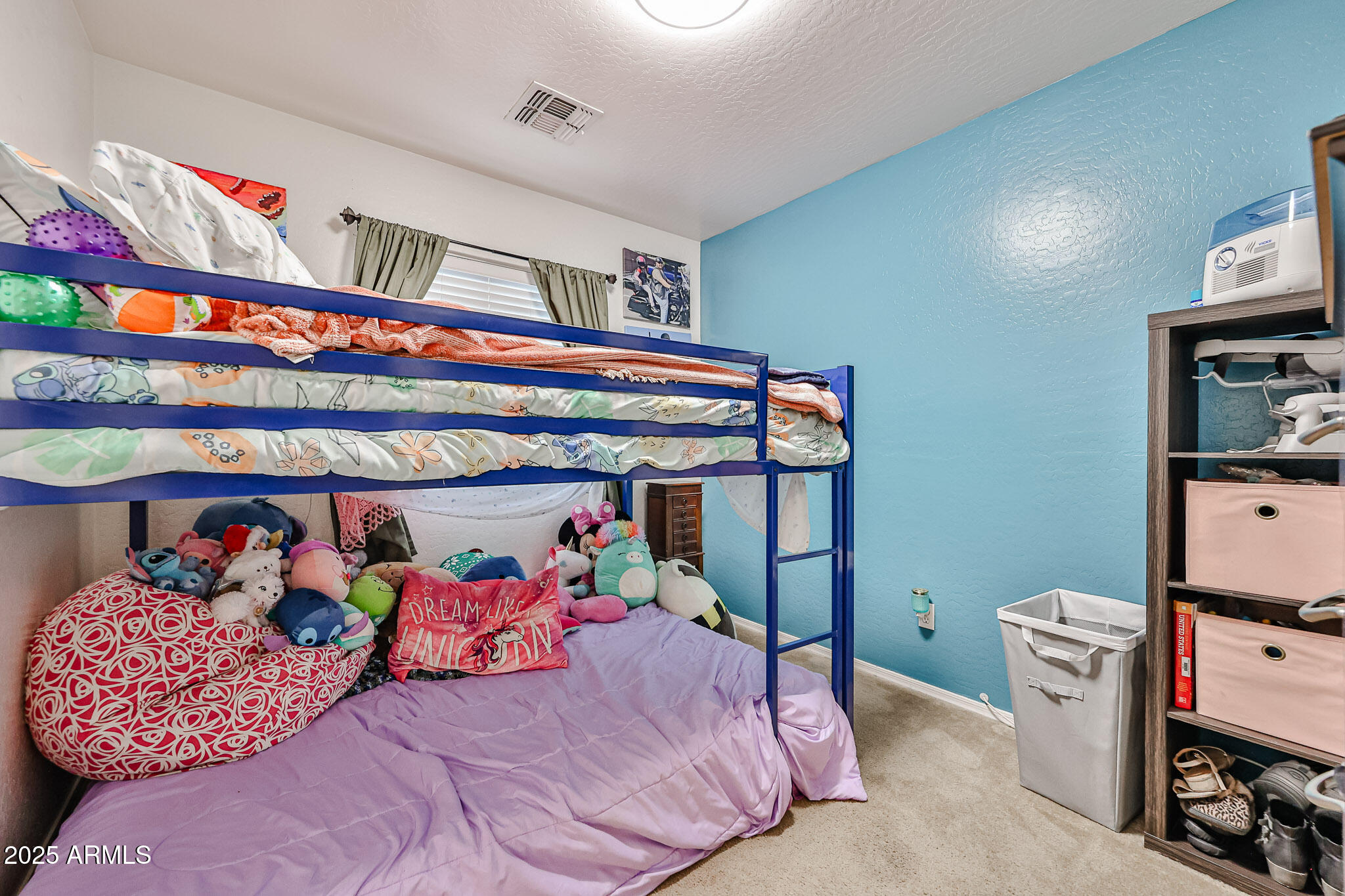 17845 West Calavar Road Surprise, AZ 85388 - Photo 10 of 26 a bed room with lots of furniture