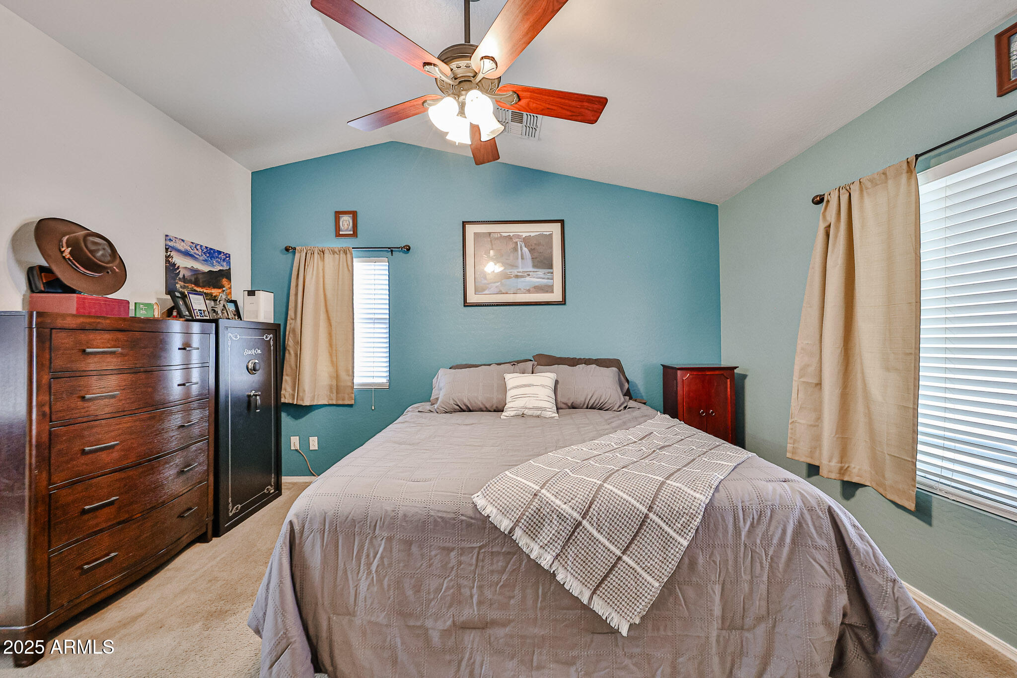 17845 West Calavar Road Surprise, AZ 85388 - Photo 15 of 26 a bedroom with a bed and a closet
