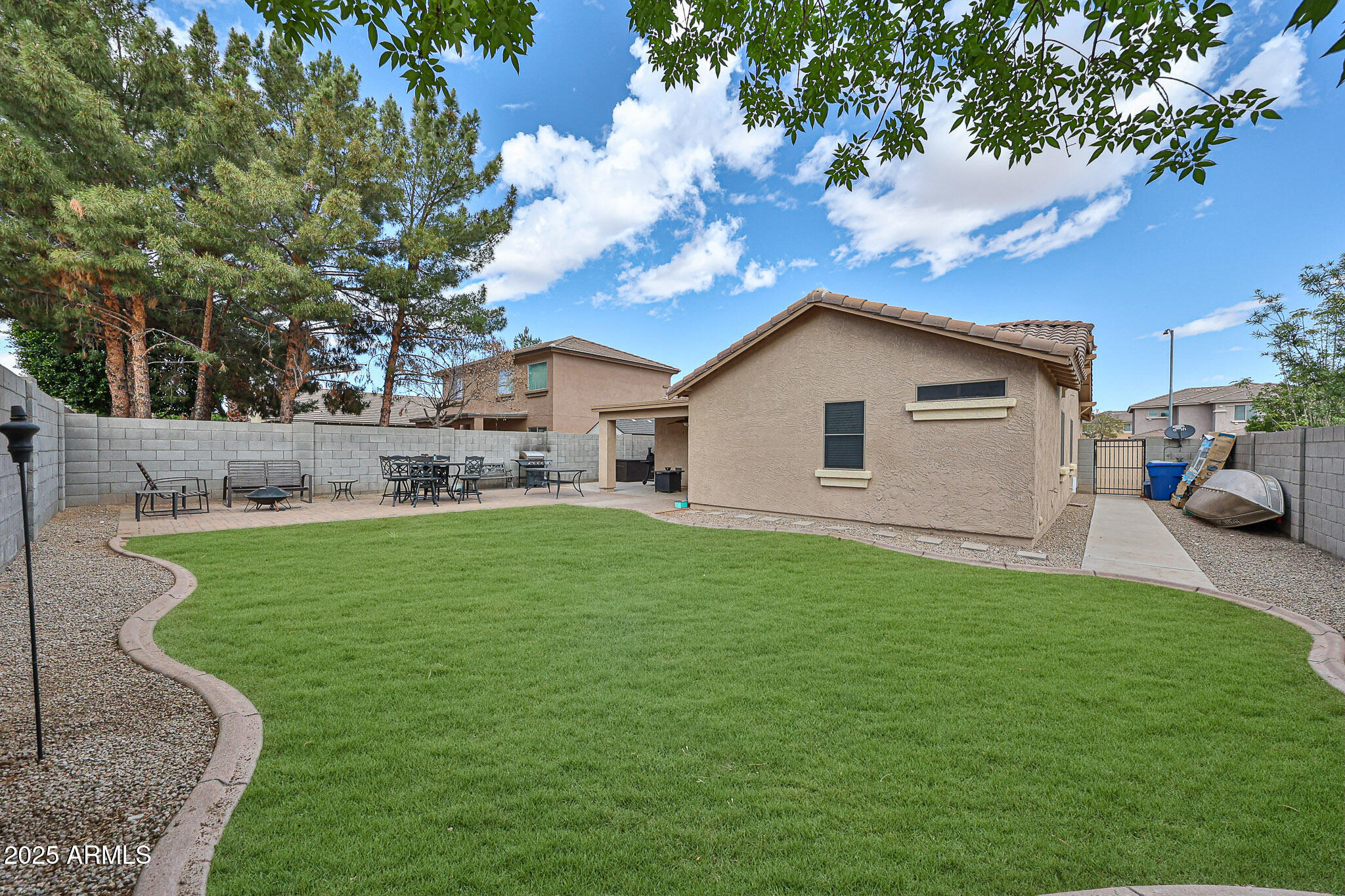 17845 West Calavar Road Surprise, AZ 85388 - Photo 24 of 26 a view of a house with a yard