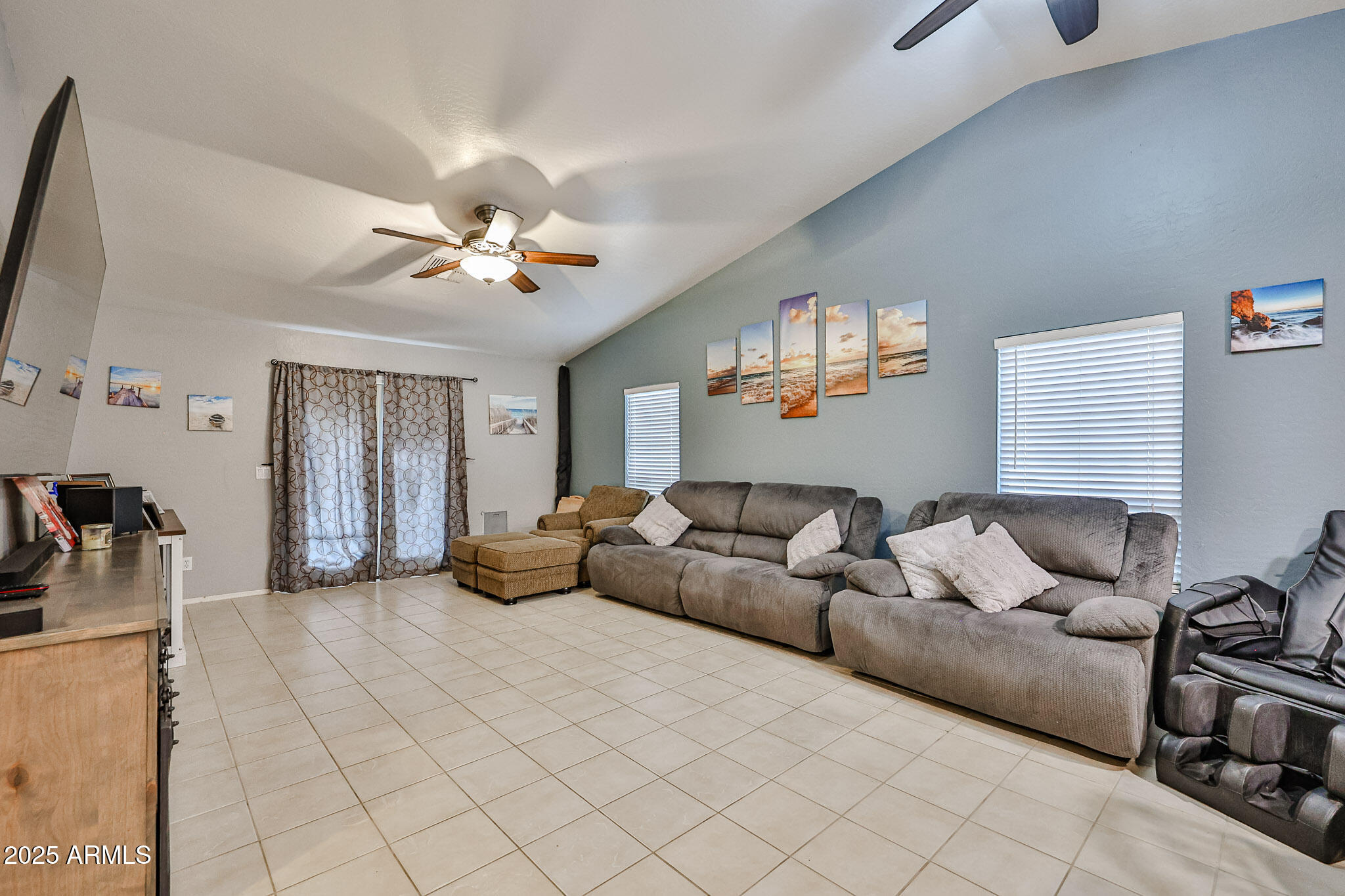 17845 West Calavar Road Surprise, AZ 85388 - Photo 3 of 26 a living room with furniture and a flat screen tv