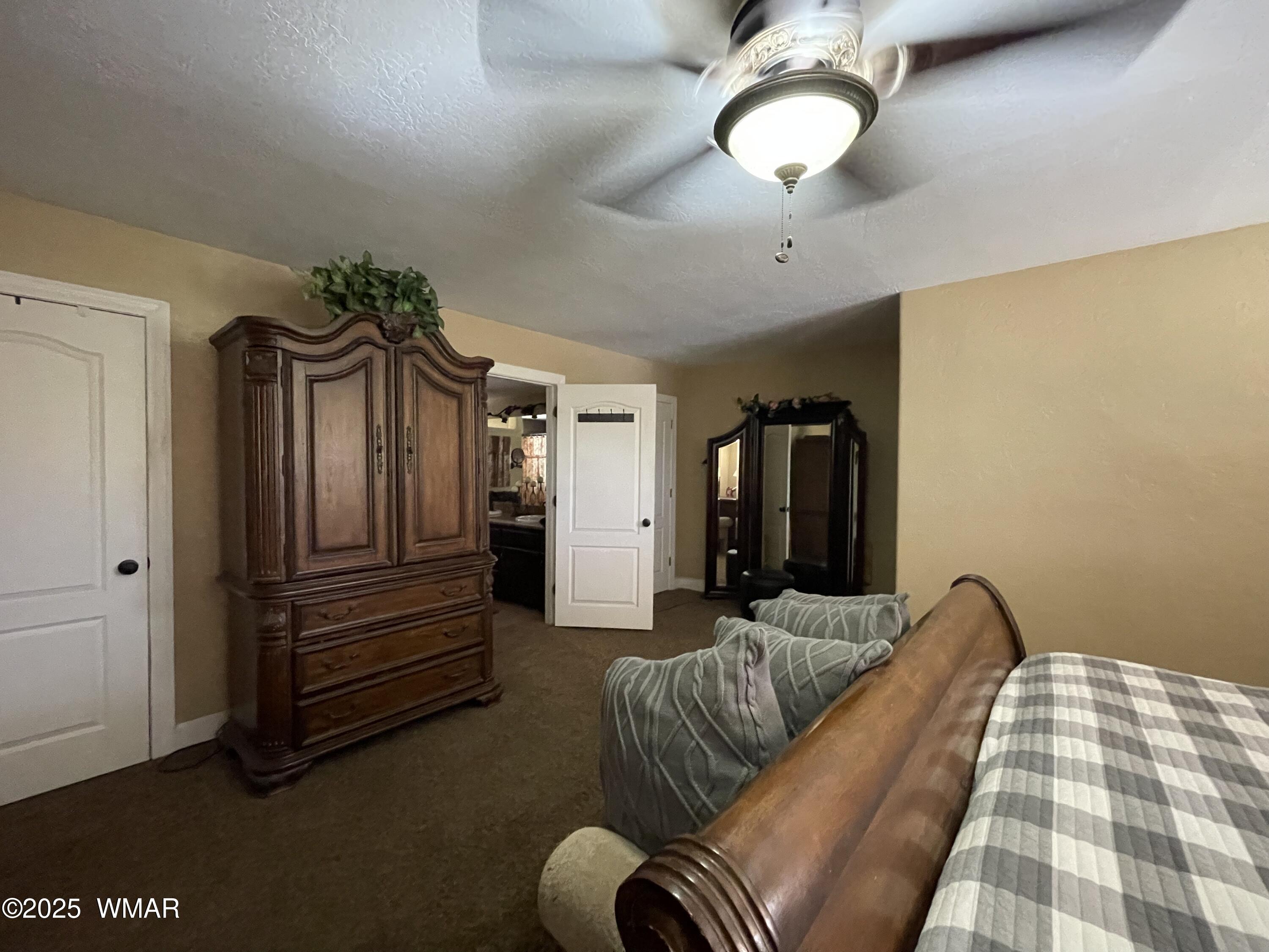183 North Becker Lake Road Springerville, AZ 85938 - Photo 28 of 41 a bedroom with furniture and wooden floor