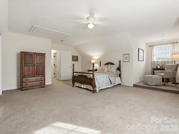 a view of a balcony with wooden floor and fence