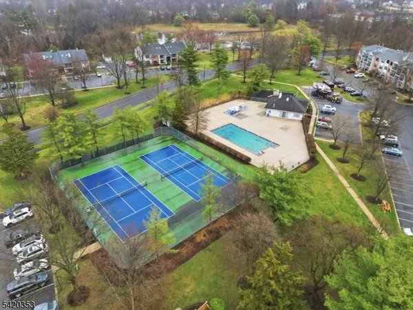 an aerial view of a houses with a yard