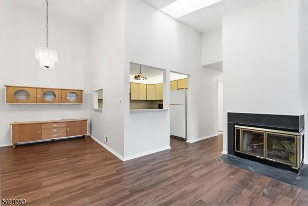 a view of a kitchen with an oven and a refrigerator