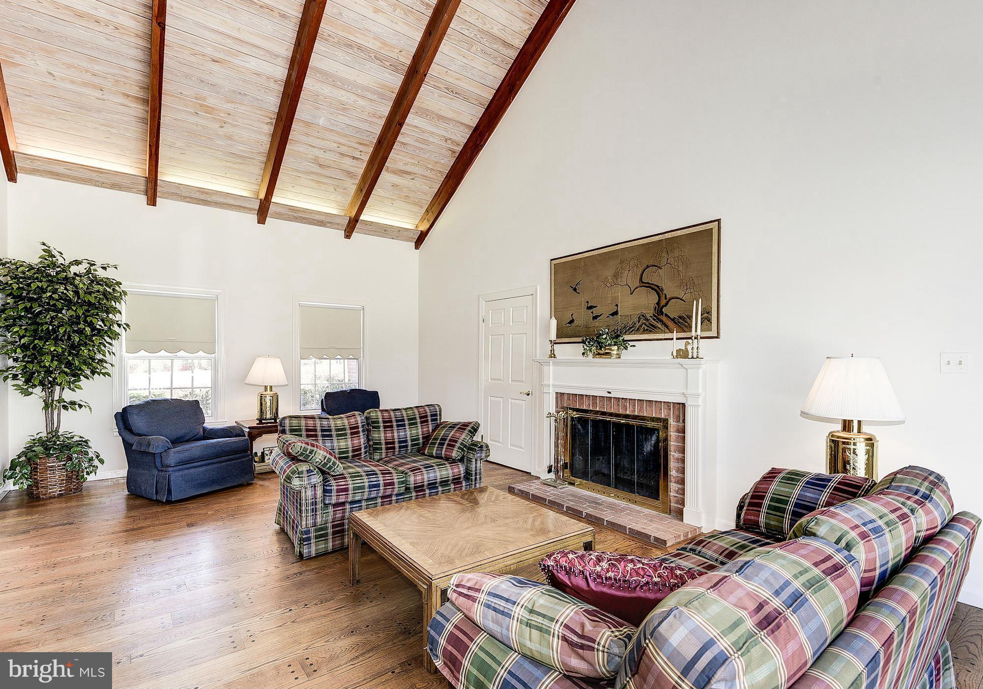 19830 Bucklodge Road Boyds, MD 20841 - Photo 14 of 30 Great room w/ fireplace, access to laundry room