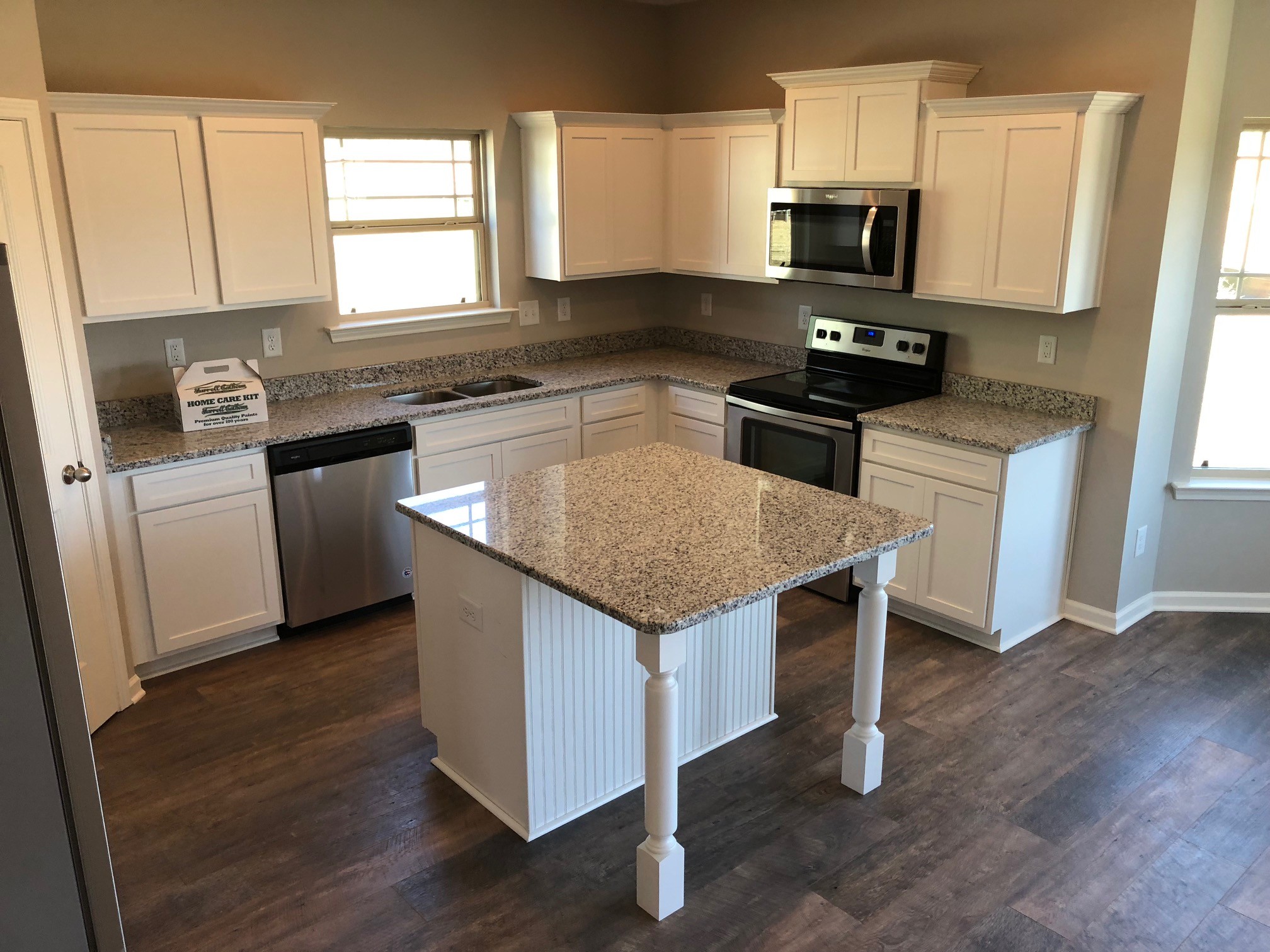 406 Wren Way Spring Hill, TN 37174 - Photo 4 of 7 a kitchen with stainless steel appliances granite countertop a sink stove microwave and refrigerator