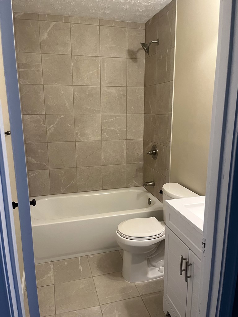 2807 Marion Street Columbus, GA 31906 - Photo 7 of 10 a bathroom with a toilet and a bath tub