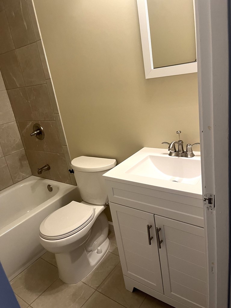 2807 Marion Street Columbus, GA 31906 - Photo 8 of 10 a white toilet sitting next to a bathroom sink