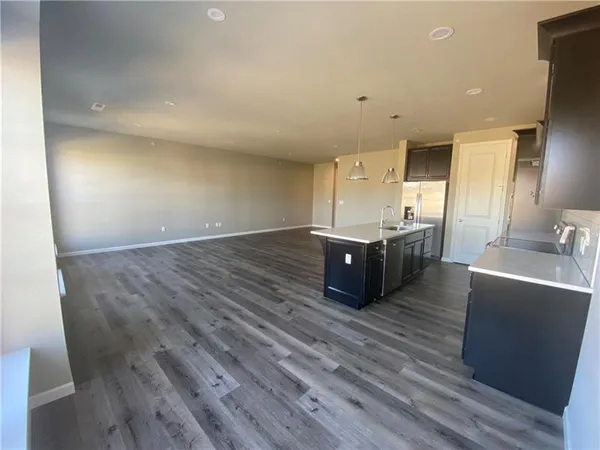 a room with wooden floors and furniture