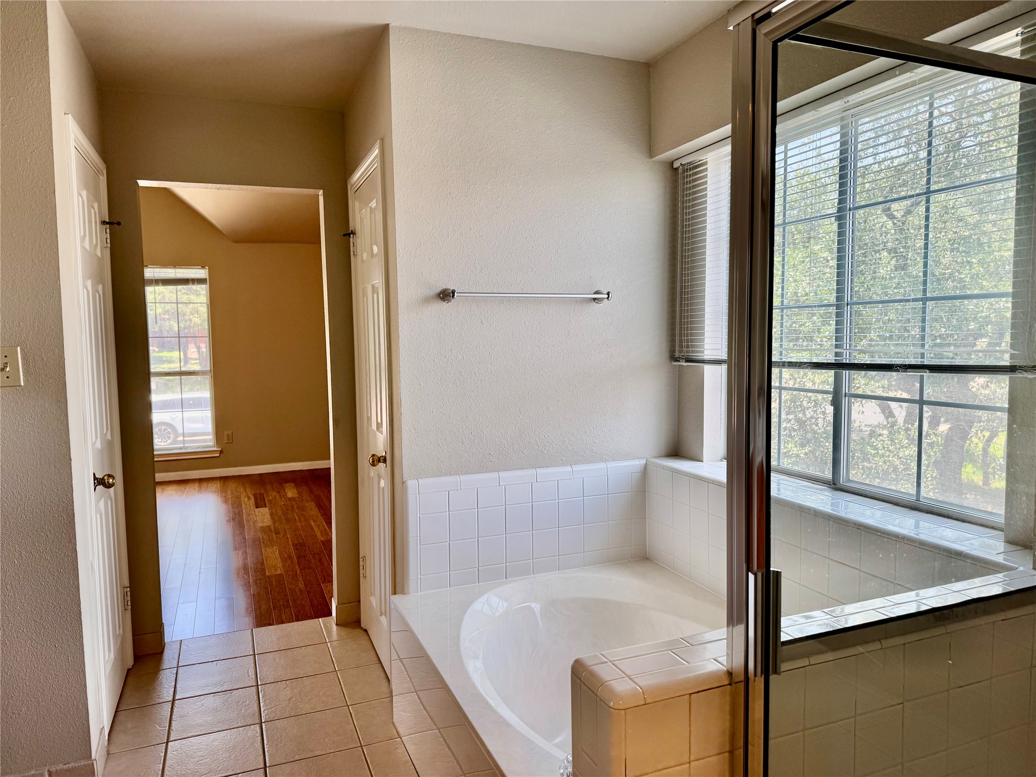 5817 Taylor Draper Cove Austin, TX 78759 - Photo 11 of 28 a bathroom with a tub and shower