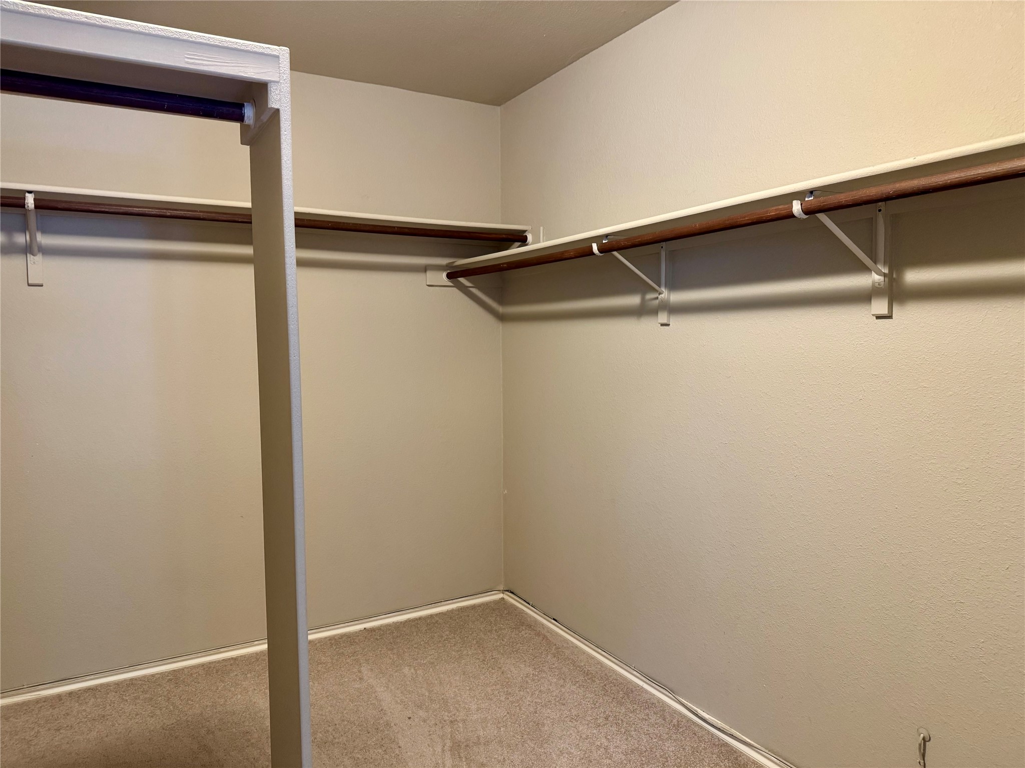 5817 Taylor Draper Cove Austin, TX 78759 - Photo 13 of 28 a view of an empty walk in closet